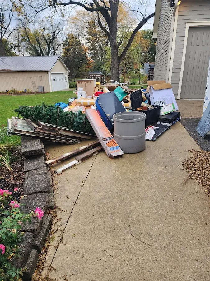 Dumpster being loaded with debris for Demolition Dumpster Rental in South Patrick Shores